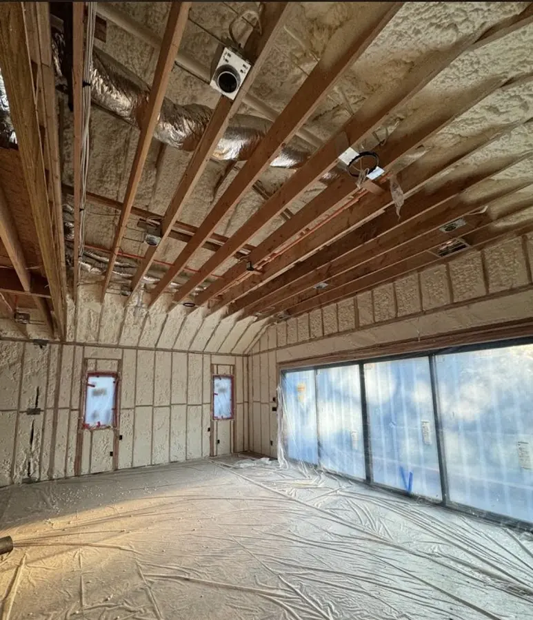 Interior walls and ceiling insulated with spray foam during new construction in Colchester